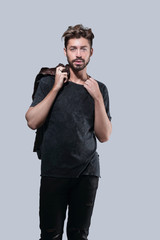 Portrait of a trendy bearded man on a gray background