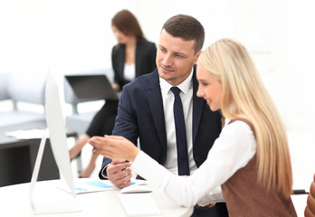 Manager talking with a colleague at the workplace