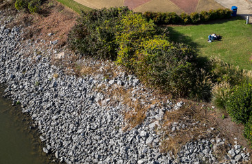 High Angle View of River Shore with Couple Chilling