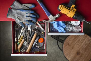 an assortment of tools in drawers in a workshop