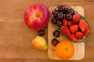 Naklejka na ściany i meble healthy fruits on wooden table