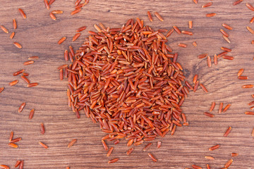 Brown rice on rustic board, healthy nutrition