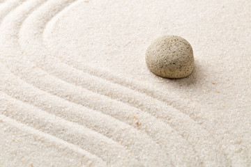 Zen sand and stone garden with raked curved lines. Simplicity, concentration or calmness abstract concept