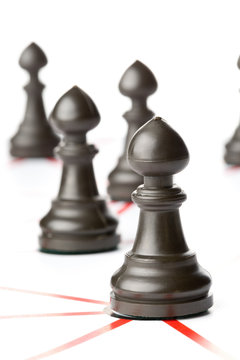 Chess pawn figures connected by red lines over white background