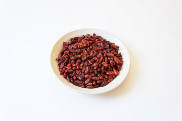 Dried red bird peppers piquin Capsicum annuum Pequin pepper, isolated on white, horizontal aspect