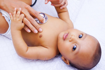 Doctor Using A Stethoscope To Listen To Baby's Chest , Baby Health Concept