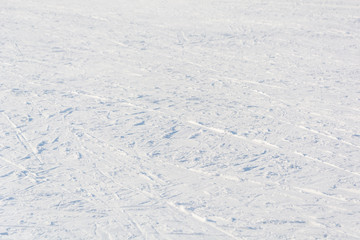 Fototapeta na wymiar The ski track. Many tracks from skis in the snow.