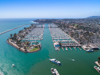 Aerial view of harbor with luxury boats and yachts in Orange County, Southern California 
