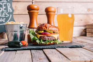 Cheeseburger on a Pretzel Bun With Craft Beer