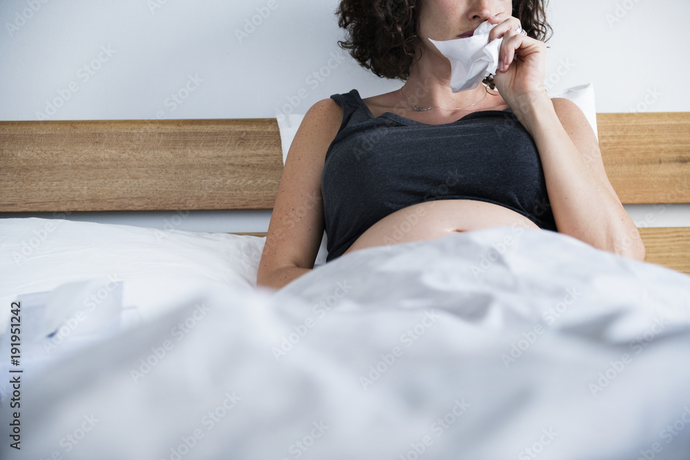 Poster Sick pregnant woman on bed