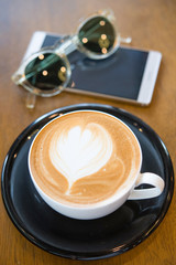 Coffee cup on wooden table