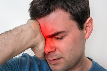 Fototapeta premium Man with eyes pain is holding his aching eye