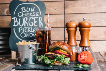 Cheeseburger on a Pretzel Bun With Soft Drink