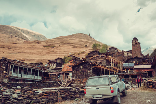 Old village Dartlo with traditional stone buildings and defensive towers in Tusheti. Adventure holiday. Travel to Georgia. Mount landscape. Green ecology tourism. Eco trekking tour. Rainy season