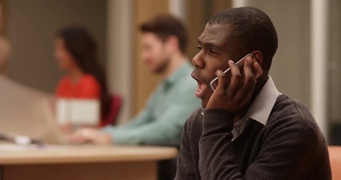 4K Very angry businessman shouting at somebody over the phone