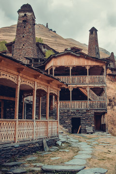 Village Dartlo with traditional stone buildings and defensive towers in Tusheti. Adventure holiday. Travel to Georgia. Ecology tourism. Eco trekking tour. Balcony decorated with fretwork. Vertical