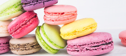 delicious pink, yellow and green row of dessert macaron,  background