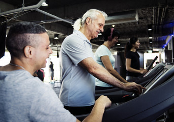 People exercising at fitness gym