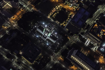Night aerial view of Los Angeles City Hall and downtown civic center buildings in Southern California.  