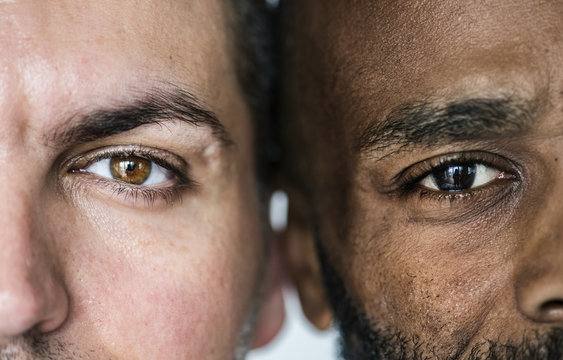 Two different ethnic men&#39;s eyes closeup