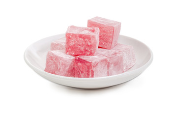 Turkish delight flavored with rose water on the white saucer