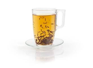 Glass cup of black tea during brewing