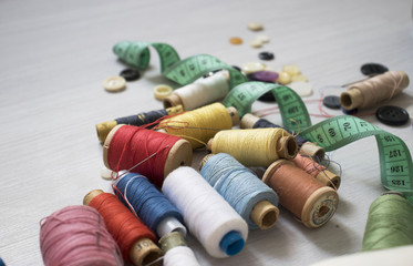 Sewing threads multicolored background closeup