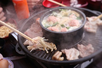 Grilled pork on a shabu pan