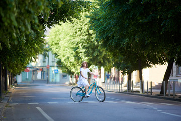 Young woman relaxing outdoors cycling in the park copyspace countryside road trip journey travelling tourism vehicle riding transportation happiness recreation harmony.