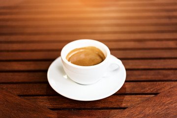 cup of coffee on the wooden table