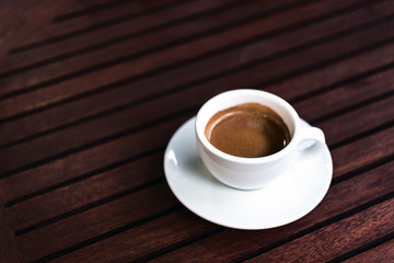 cup of coffee on the wooden table