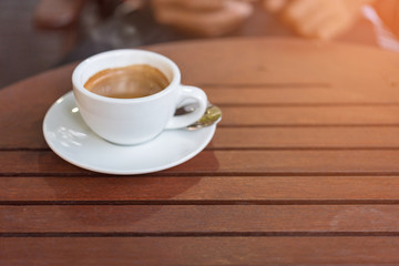 cup of coffee on the wooden table