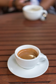 cup of coffee on the wooden table