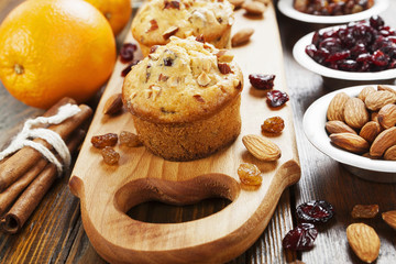 Obraz na płótnie Canvas Orange muffins with dried fruits