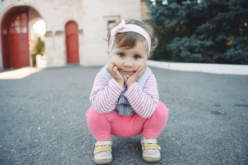 Girl Sitting on Her Haunches