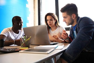 Startup Diversity Teamwork Brainstorming Meeting Concept.Business Team Coworkers Sharing World Economy Report Document Laptop.People Working Planning Start Up.Group Young Hipsters Discussing Cafe
