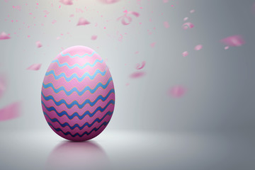 Colorful easter egg with pink confetti