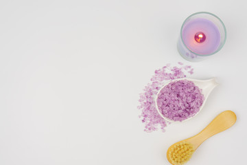 spa wellness set.beauty and fashion set on the white table.spa towel with candle and plumeria, tree on the white table.