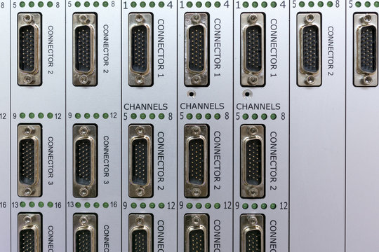 A panel with a lot of multi-pin connectors. 
