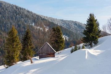 Old wooden house in the winter