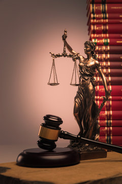 gavel, law books and justice statue