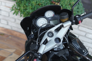 Working panel of a motorcycle in a parking day