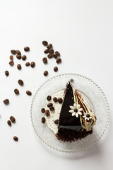 piece of chocolate cake on a glass saucer  from above