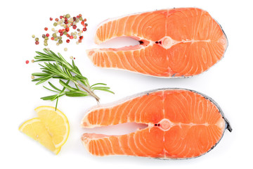 Slice of red fish salmon with lemon, rosemary and peppercorns isolated on white background. Top view. Flat lay
