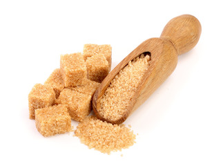 brown sugar in wooden scoop isolated on white background. Top view