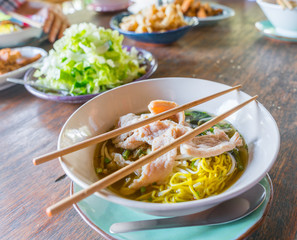 Asian food with chop stcks on set table