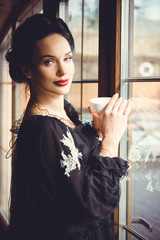 Beautiful stylish lady in vintage look, retro or vintage style in modern city life  