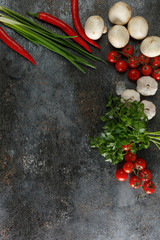 Fresh juicy vegetables with copy space on black background, top view.