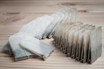 Tea in bags, brewed on a wooden background