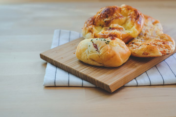 Homemade breads or bun on wood background, breakfast food